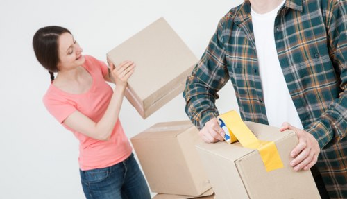 Commercial movers handling furniture and equipment in a French city