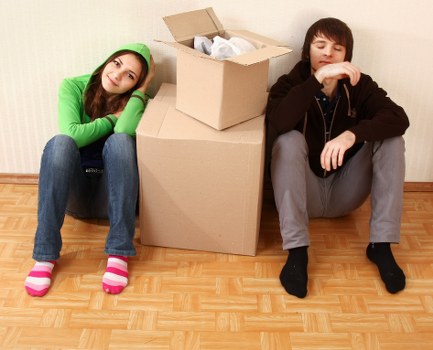 Residential movers handling furniture in a French home