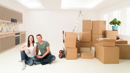 Packed office furniture and labelled boxes ready for relocation