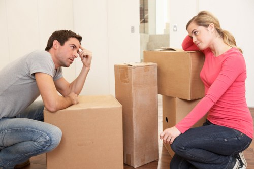 Furniture being carried down stairs during a city relocation