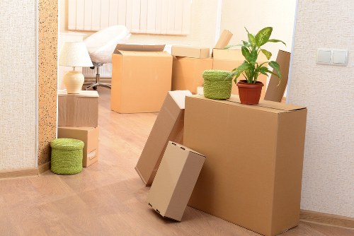 Team handling desks and IT equipment during an office move