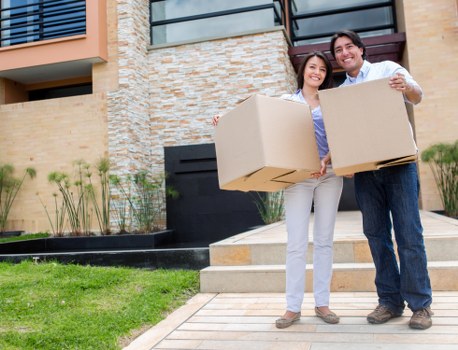 Professional movers loading furniture for a local relocation