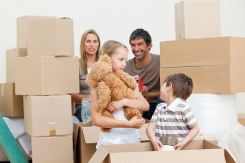 Movers handling furniture carefully in a typical French apartment building